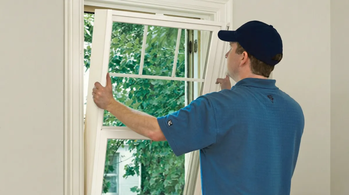 Professional contractors performing a residential window insulation and replacement service in Cincinnati, OH